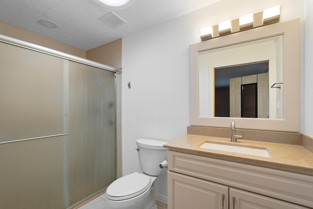 1048 Betts St NE, Albuquerque, NM 87112 - full bath featuring vanity, a shower stall, and a textured ceiling