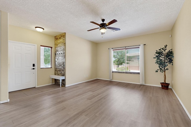11008 Marina Gate Trl NE, Albuquerque, NM 87123 - entrance foyer featuring light wood-style floors, ceiling fan, and a textured ceiling