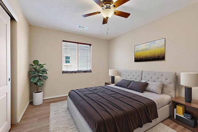 11008 Marina Gate Trl NE, Albuquerque, NM 87123 - bedroom with light wood-style flooring and ceiling fan
