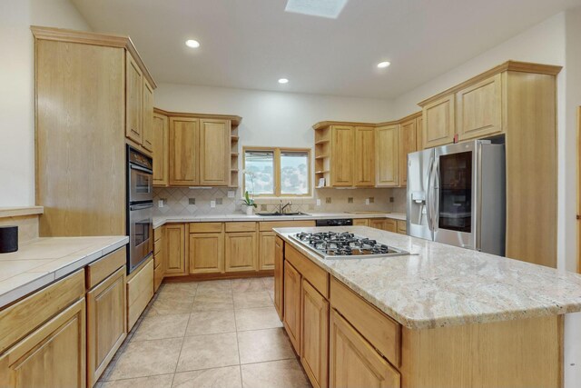39 Pine Rd, Placitas, NM 87043 - kitchen with appliances with stainless steel finishes, open shelves, decorative backsplash, light brown cabinetry, and recessed lighting