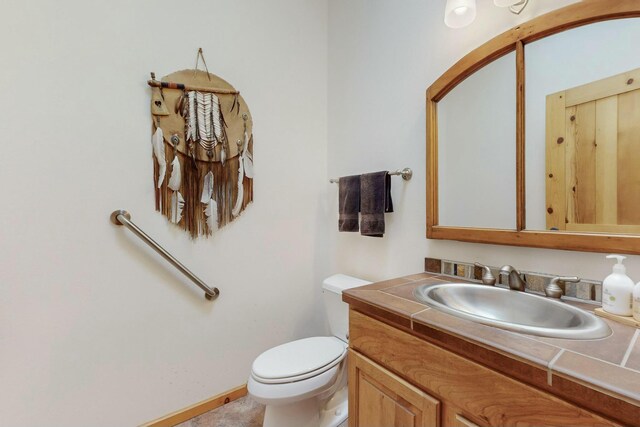 39 Pine Rd, Placitas, NM 87043 - bathroom featuring vanity and toilet