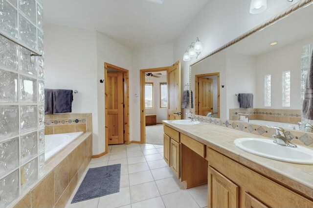 39 Pine Rd, Placitas, NM 87043 - bathroom with a garden tub, double vanity, and tile patterned floors