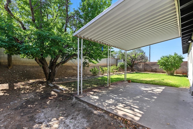 11517 San Jacinto Ave NE, Albuquerque, NM 87112 - fenced backyard with a patio area