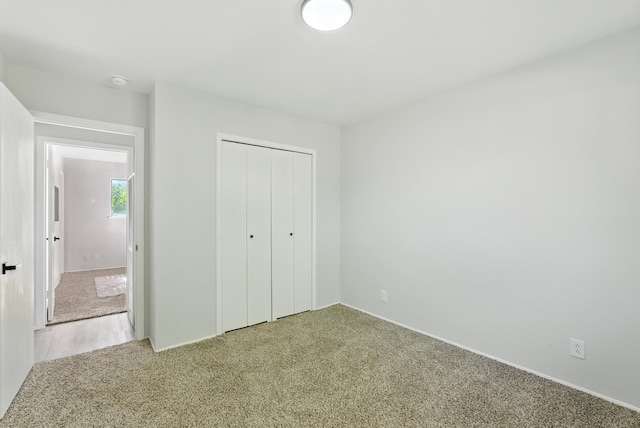 11517 San Jacinto Ave NE, Albuquerque, NM 87112 - unfurnished bedroom featuring light carpet and a closet