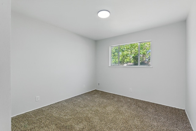 11517 San Jacinto Ave NE, Albuquerque, NM 87112 - spare room featuring carpet flooring and baseboards