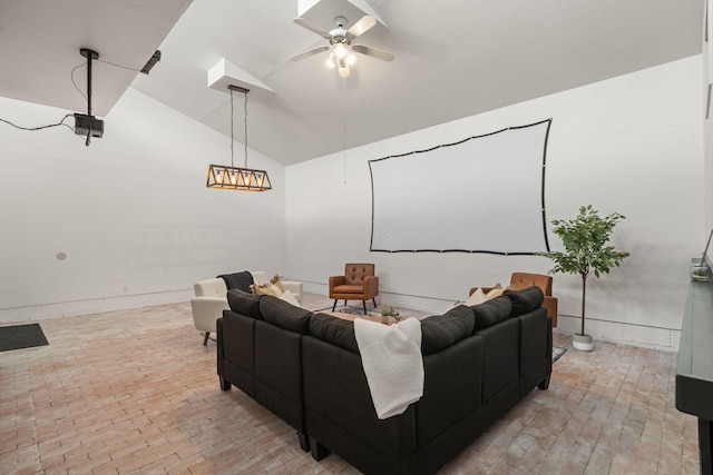 121 Pearl Dr NE, Rio Rancho, NM 87124 - home theater room with ceiling fan, vaulted ceiling, and brick floors