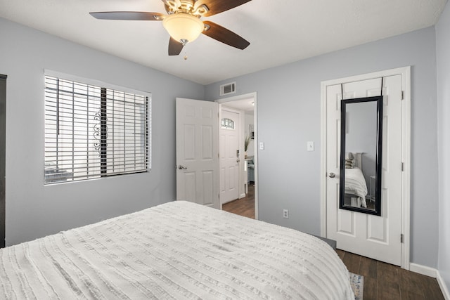 121 Pearl Dr NE, Rio Rancho, NM 87124 - bedroom featuring dark wood finished floors, a ceiling fan, and a closet