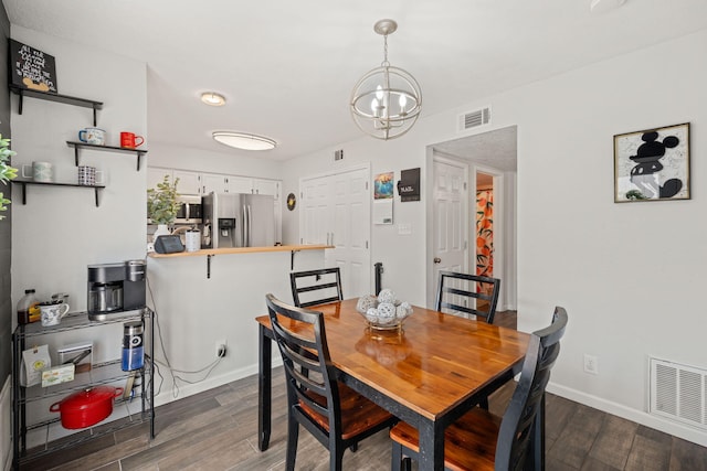 121 Pearl Dr NE, Rio Rancho, NM 87124 - dining room featuring dark wood-style floors and a chandelier