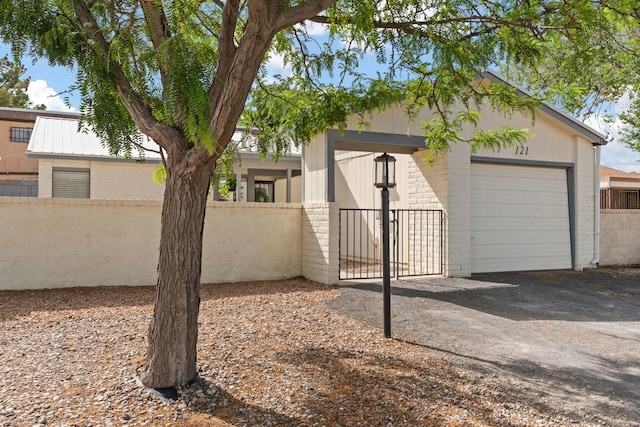 121 Pearl Dr NE, Rio Rancho, NM 87124 - view of front of property with a fenced front yard, a garage, and brick siding
