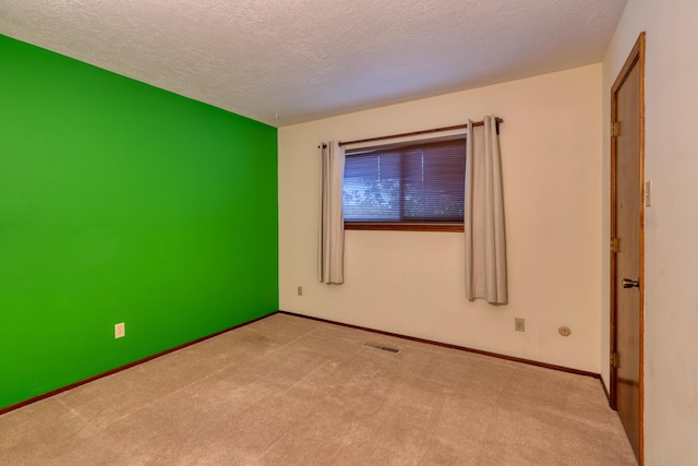 9201 Academy Hills Dr NE, Albuquerque, NM 87111 - carpeted empty room with a textured ceiling and baseboards