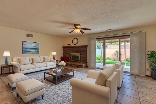 9201 Academy Hills Dr NE, Albuquerque, NM 87111 - spare room with a textured ceiling, ceiling fan, and light tile patterned floors