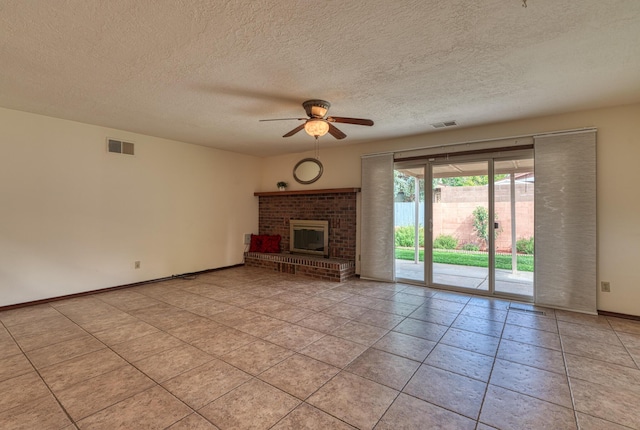 9201 Academy Hills Dr NE, Albuquerque, NM 87111 - unfurnished living room with ceiling fan, a fireplace, a textured ceiling, and light tile patterned floors