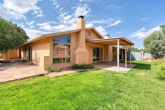 9201 Academy Hills Dr NE, Albuquerque, NM 87111 - back of property featuring a patio, a chimney, and stucco siding