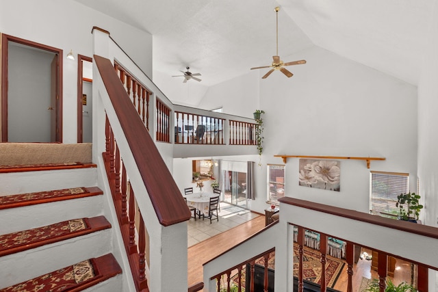 7824 Snowberry St NW, Albuquerque, NM 87120 - stairway featuring ceiling fan, high vaulted ceiling, and healthy amount of natural light