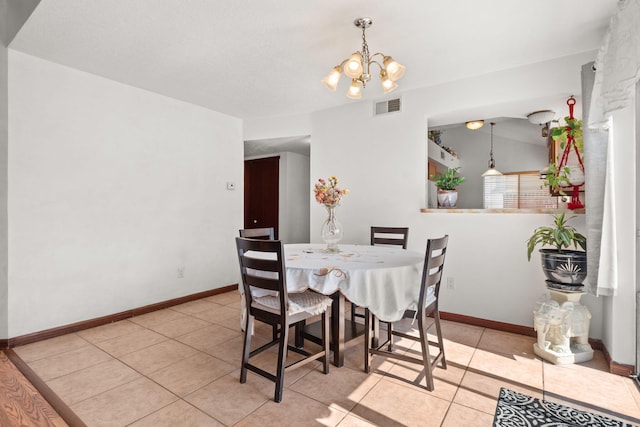 7824 Snowberry St NW, Albuquerque, NM 87120 - dining space featuring a chandelier and light tile patterned floors