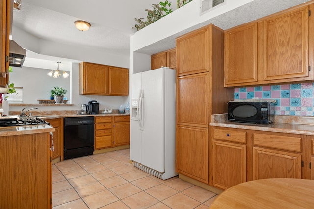7824 Snowberry St NW, Albuquerque, NM 87120 - kitchen featuring black appliances, light tile patterned flooring, tasteful backsplash, light countertops, and brown cabinets