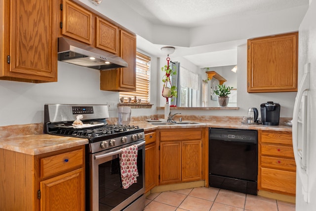 7824 Snowberry St NW, Albuquerque, NM 87120 - kitchen featuring dishwasher, stainless steel gas range, under cabinet range hood, and light countertops