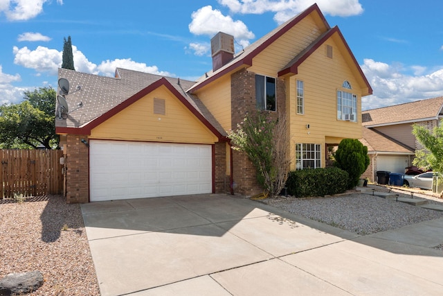 7824 Snowberry St NW, Albuquerque, NM 87120 - traditional home with brick siding, a garage, driveway, and a chimney