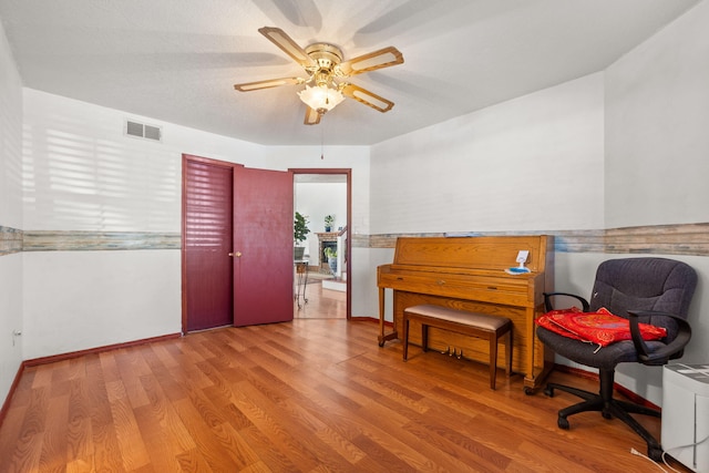 7824 Snowberry St NW, Albuquerque, NM 87120 - living area featuring wood finished floors and a ceiling fan