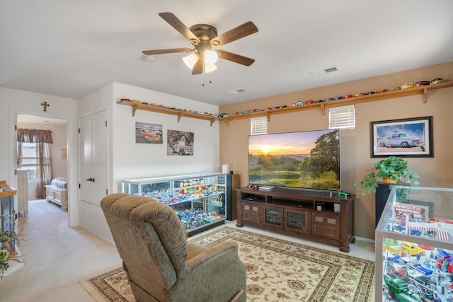 1417 Montiano Loop SE, Rio Rancho, NM 87124 - carpeted living area with a ceiling fan and baseboards