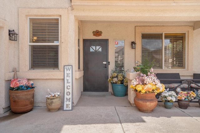 1417 Montiano Loop SE, Rio Rancho, NM 87124 - doorway to property with stucco siding