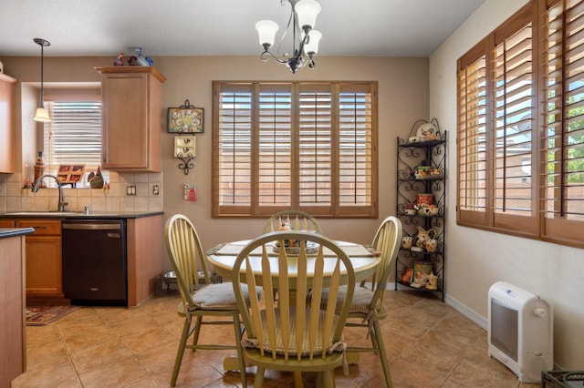 1417 Montiano Loop SE, Rio Rancho, NM 87124 - dining room featuring plenty of natural light, a chandelier, and light tile patterned flooring