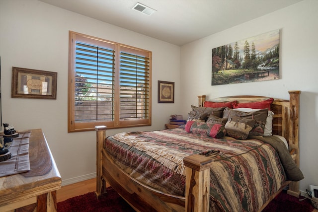 1417 Montiano Loop SE, Rio Rancho, NM 87124 - bedroom featuring baseboards and wood finished floors