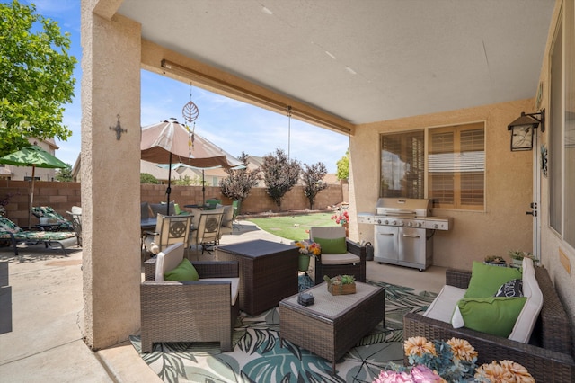 1417 Montiano Loop SE, Rio Rancho, NM 87124 - fenced backyard featuring grilling area, an outdoor hangout area, outdoor dining area, and a patio area
