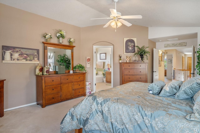 1417 Montiano Loop SE, Rio Rancho, NM 87124 - bedroom featuring vaulted ceiling, light colored carpet, connected bathroom, and a ceiling fan