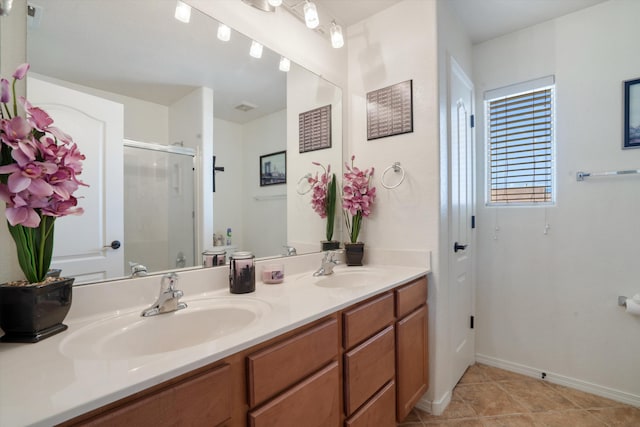 1417 Montiano Loop SE, Rio Rancho, NM 87124 - full bath featuring double vanity, a stall shower, and tile patterned flooring