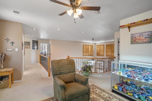 1417 Montiano Loop SE, Rio Rancho, NM 87124 - living area with a ceiling fan, light colored carpet, plenty of natural light, recessed lighting, and an upstairs landing