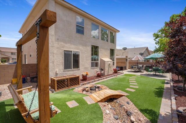 1417 Montiano Loop SE, Rio Rancho, NM 87124 - rear view of house with stucco siding and a patio area