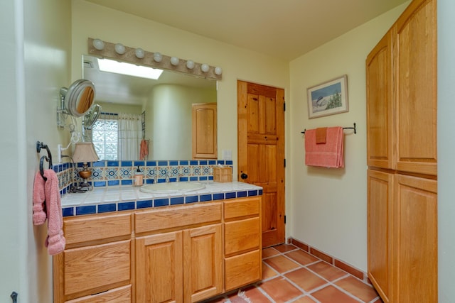 15 Sunset Blvd, Placitas, NM 87043 - bathroom featuring vanity, tasteful backsplash, and tile patterned flooring