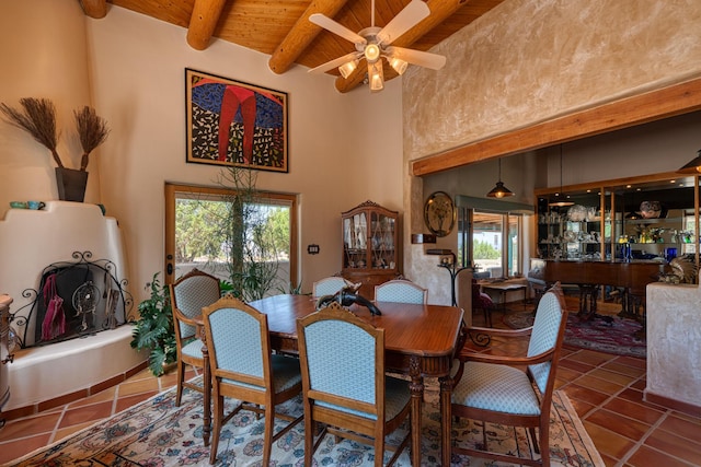 15 Sunset Blvd, Placitas, NM 87043 - tiled dining space with a wood ceiling with exposed beams, ceiling fan, and a towering ceiling