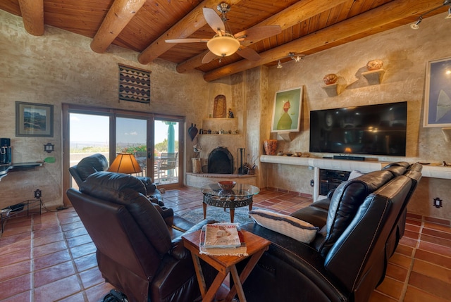 15 Sunset Blvd, Placitas, NM 87043 - tiled living area with a wooden ceiling with exposed beams, a fireplace, and a ceiling fan