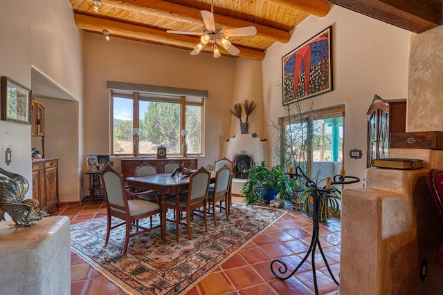 15 Sunset Blvd, Placitas, NM 87043 - dining area with a wooden ceiling with exposed beams, healthy amount of natural light, tile patterned floors, a high ceiling, and ceiling fan