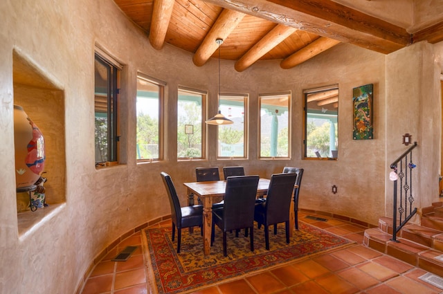 15 Sunset Blvd, Placitas, NM 87043 - dining room featuring a wooden ceiling with exposed beams, tile patterned floors, and a textured wall