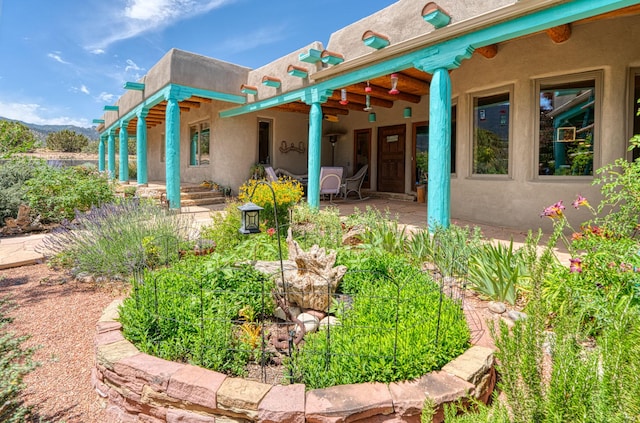 15 Sunset Blvd, Placitas, NM 87043 - back of property with a patio area and stucco siding