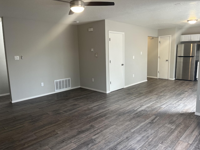 3005 Quail Point Dr, Albuquerque, NM 87120 - unfurnished living room featuring ceiling fan, dark wood finished floors, and a textured ceiling