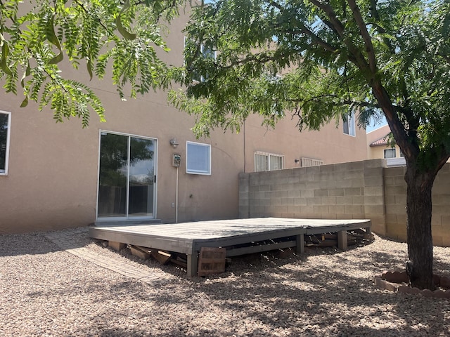 3005 Quail Point Dr, Albuquerque, NM 87120 - back of house with a wooden deck and stucco siding