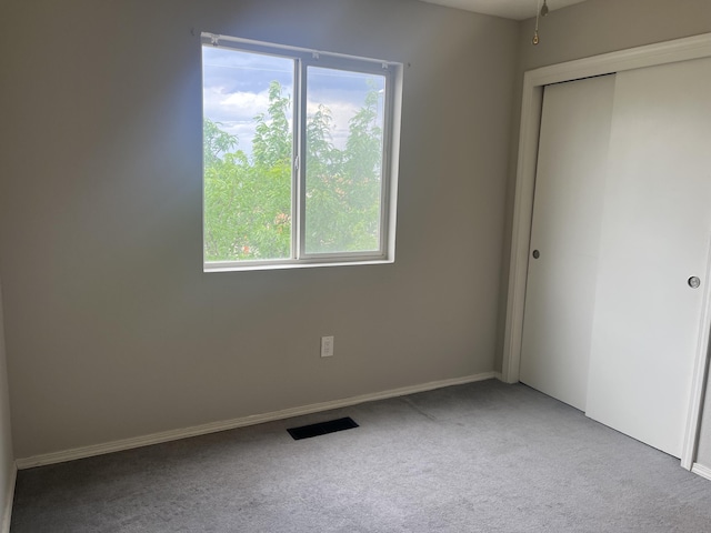 3005 Quail Point Dr, Albuquerque, NM 87120 - unfurnished bedroom featuring carpet, multiple windows, and a closet