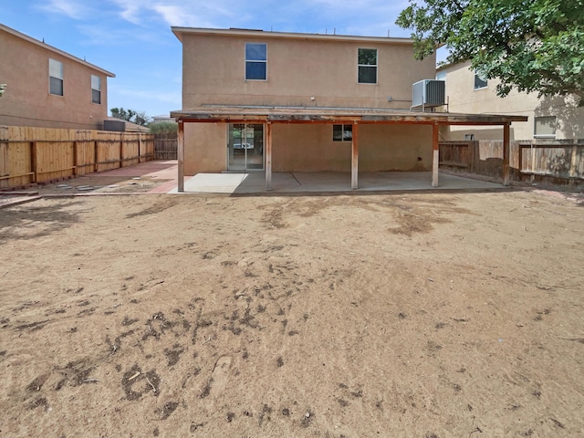 5355 Feather Rock Pl NW, Albuquerque, NM 87114 - rear view of property featuring a patio area, stucco siding, and a fenced backyard