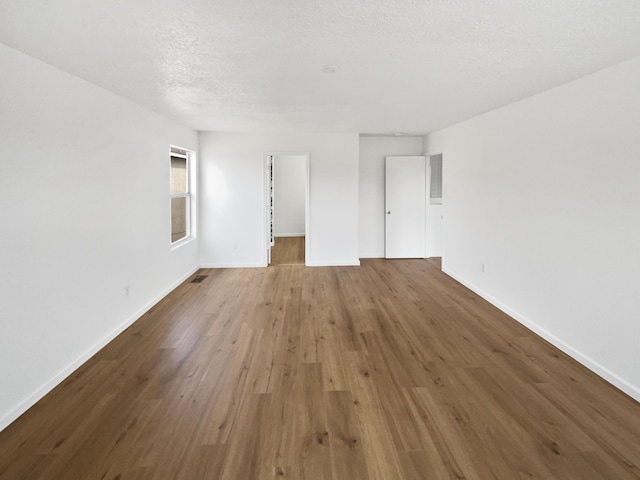 5355 Feather Rock Pl NW, Albuquerque, NM 87114 - empty room featuring baseboards and wood finished floors