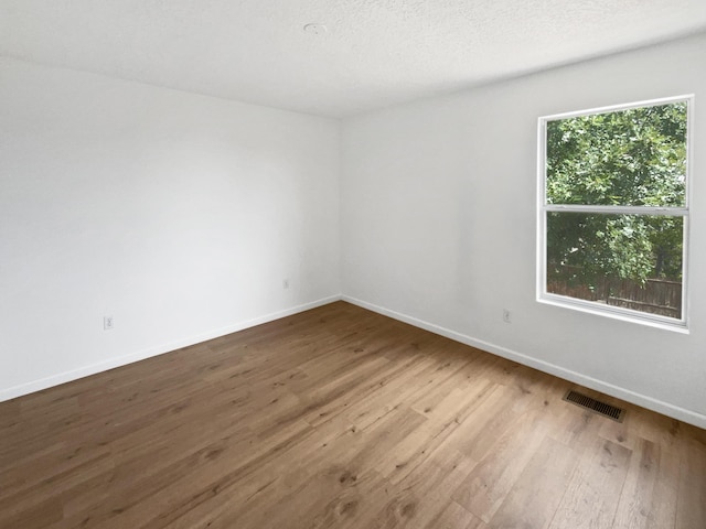5355 Feather Rock Pl NW, Albuquerque, NM 87114 - unfurnished room with wood finished floors and baseboards