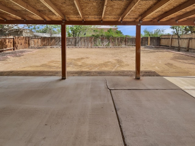 5355 Feather Rock Pl NW, Albuquerque, NM 87114 - fenced backyard with a patio area