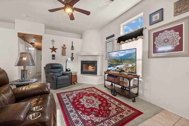455 Colonial Ave SW, Los Lunas, NM 87031 - carpeted living room featuring ceiling fan and a fireplace