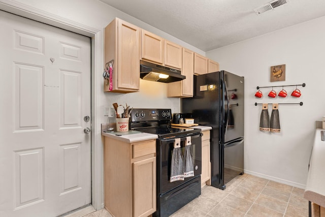 455 Colonial Ave SW, Los Lunas, NM 87031 - kitchen featuring black appliances, under cabinet range hood, light brown cabinetry, and light countertops