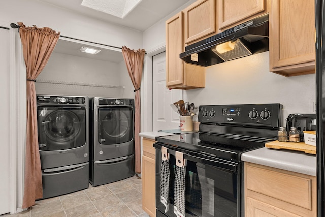 455 Colonial Ave SW, Los Lunas, NM 87031 - kitchen featuring black electric range oven, under cabinet range hood, washer and dryer, light brown cabinetry, and light countertops