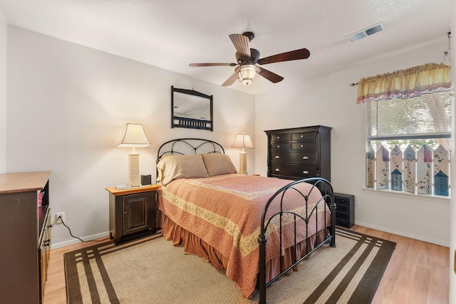 455 Colonial Ave SW, Los Lunas, NM 87031 - bedroom with light wood finished floors and a ceiling fan