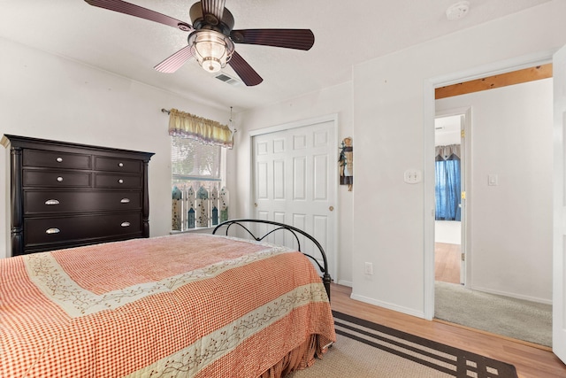 455 Colonial Ave SW, Los Lunas, NM 87031 - bedroom with a closet, light wood finished floors, and ceiling fan